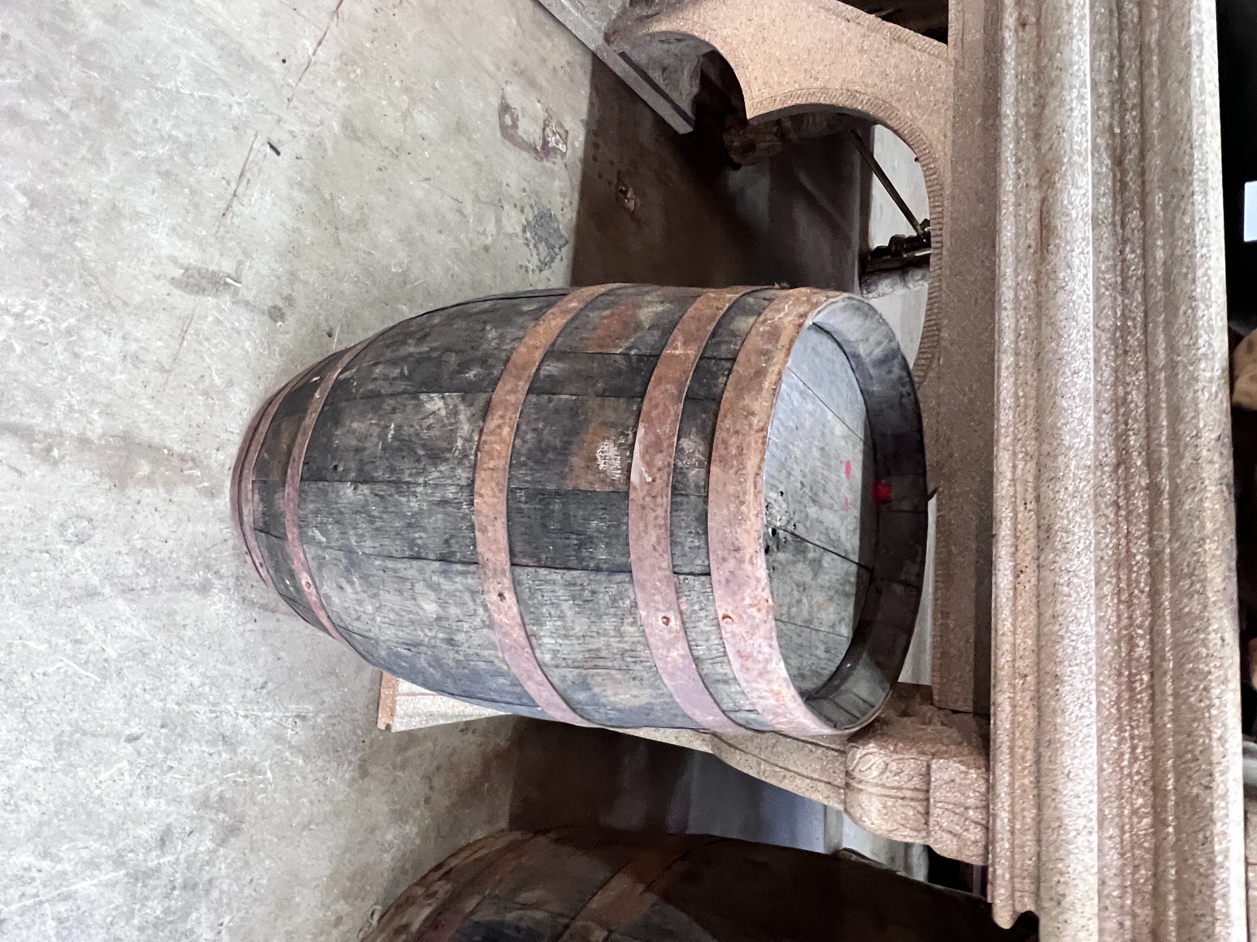 Three iron bound staved wood barrels, largest height 98cm